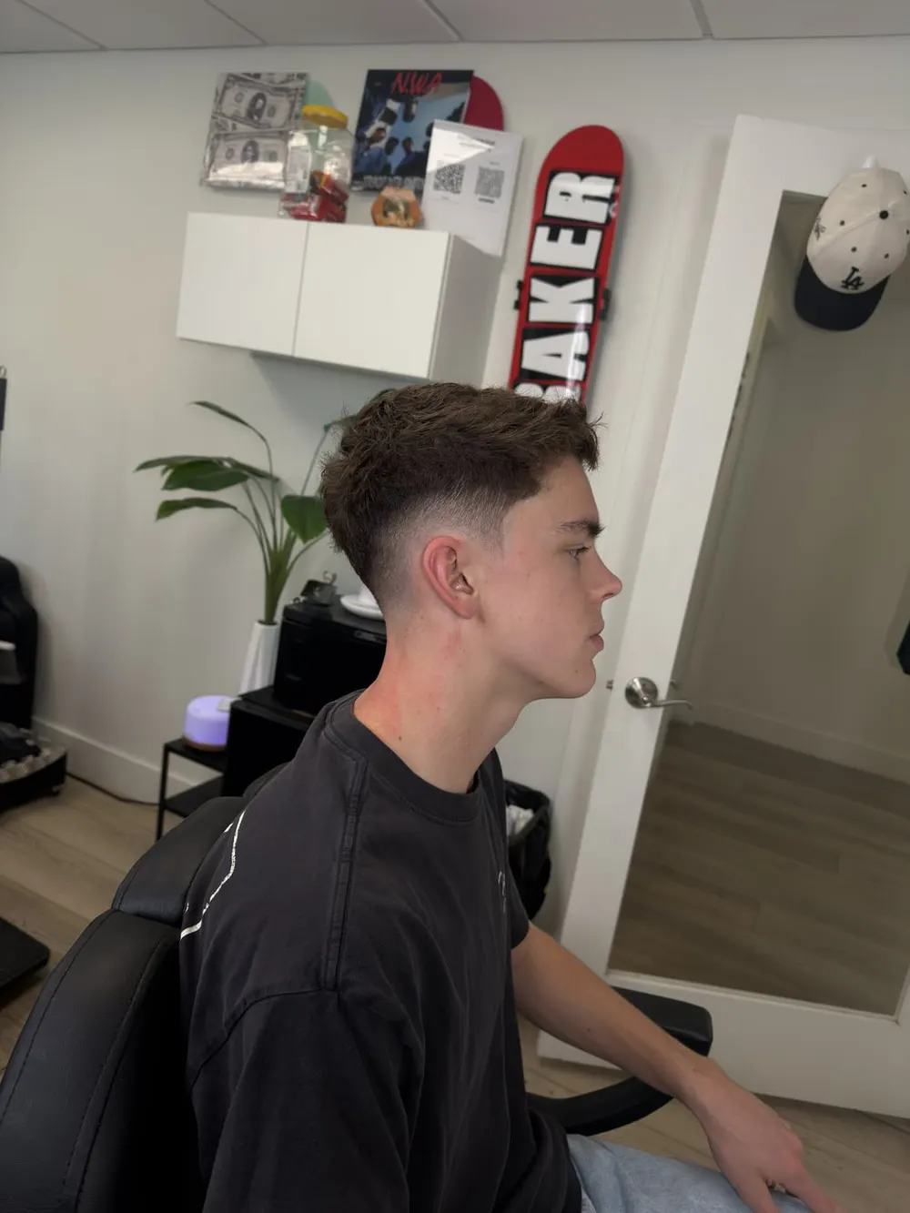 Textured top mid skin fade by AJ at Bulletproof Barbering in Bountiful, Utah