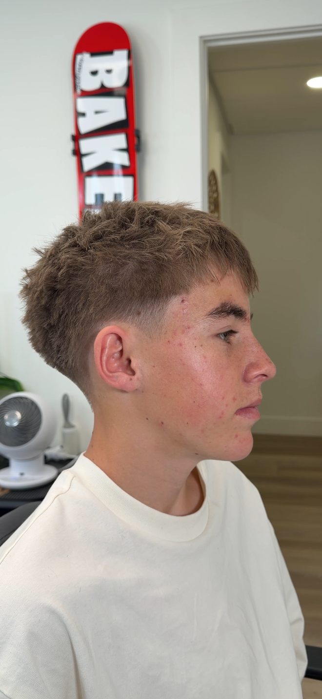 Textured crop with a mid-taper skin fade, side profile