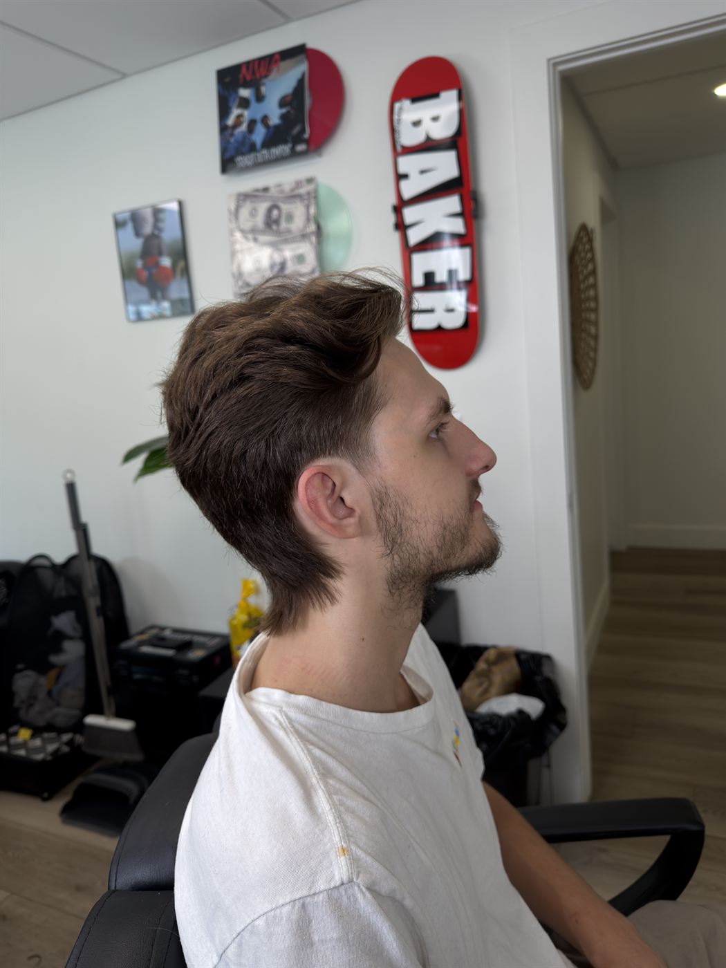 Textured mullet quiff with a taper and beard, side profile