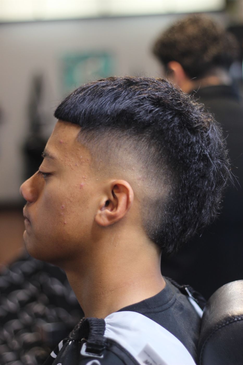 AJ's work: a mullet with a clean high skin fade, side profile